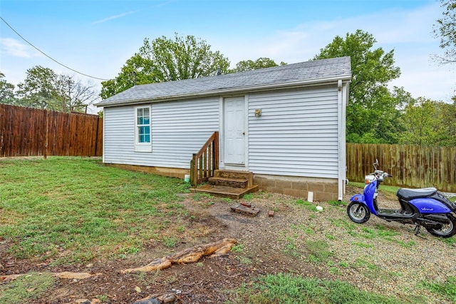 view of outbuilding with a lawn