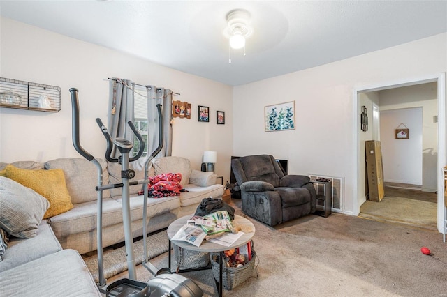 living room featuring ceiling fan and light colored carpet