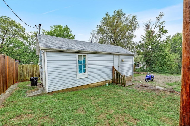 rear view of property with a lawn