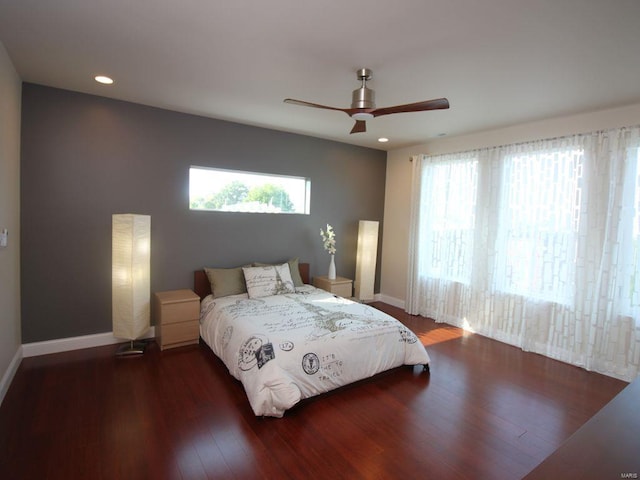 bedroom featuring ceiling fan and dark hardwood / wood-style floors