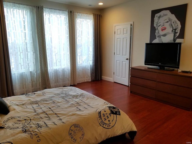 bedroom featuring dark hardwood / wood-style floors