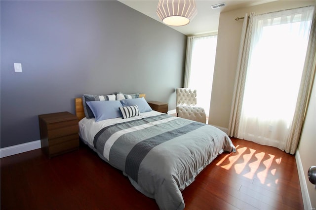 bedroom featuring dark hardwood / wood-style flooring