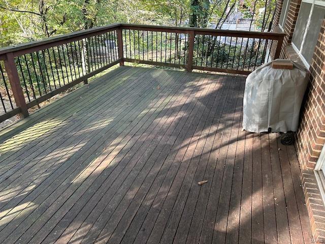 wooden deck featuring grilling area