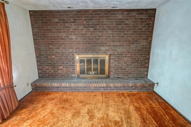 interior details featuring carpet flooring and a fireplace