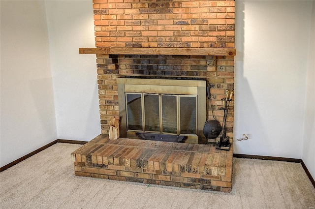 details featuring a fireplace and carpet