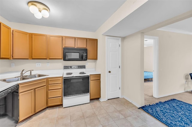 kitchen with light tile patterned flooring, sink, and black appliances