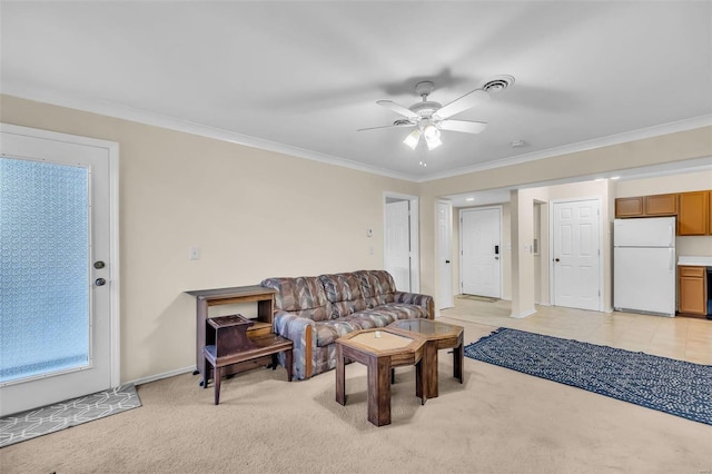 carpeted living room with ceiling fan and ornamental molding