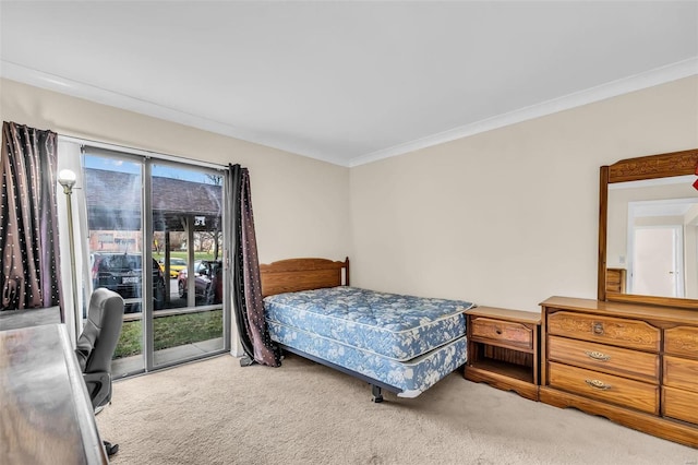 carpeted bedroom featuring access to outside and ornamental molding