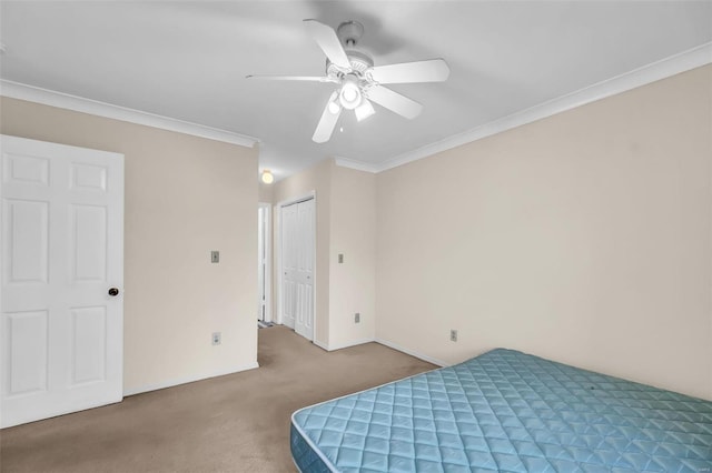 carpeted bedroom with ceiling fan and ornamental molding