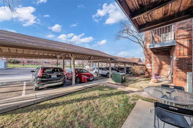 view of parking / parking lot with a carport