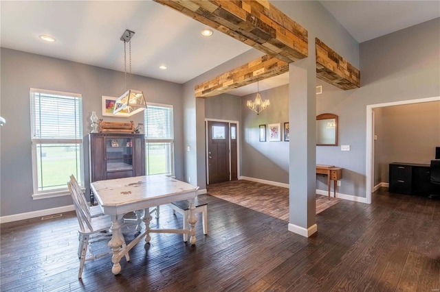 dining room with an inviting chandelier and dark hardwood / wood-style flooring