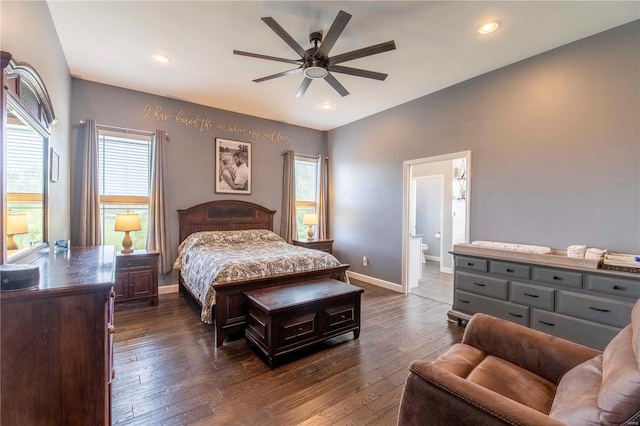 bedroom with ceiling fan, ensuite bath, and dark hardwood / wood-style flooring