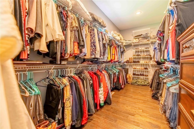 walk in closet with light wood-type flooring