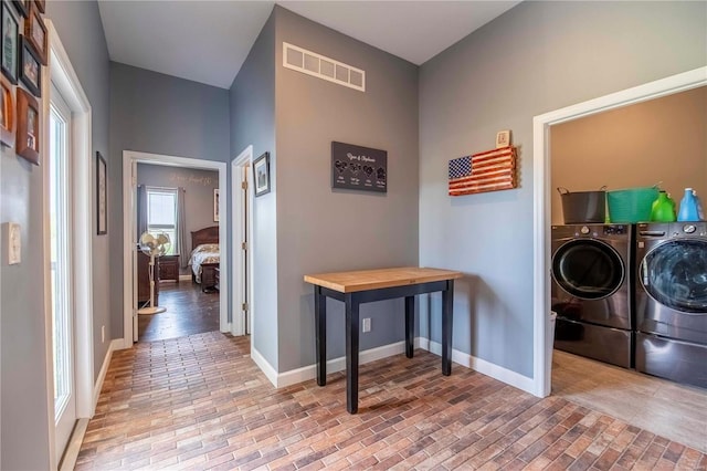 laundry room with washer and clothes dryer