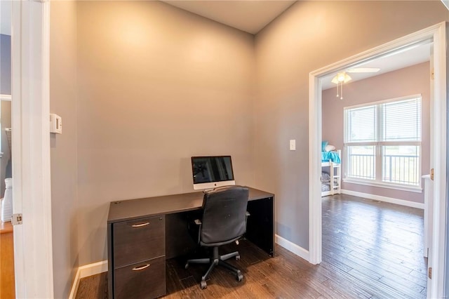 home office with wood-type flooring and ceiling fan