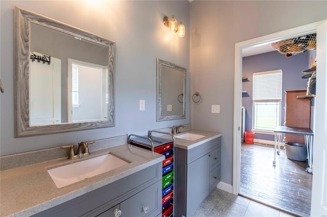 bathroom with vanity and hardwood / wood-style flooring