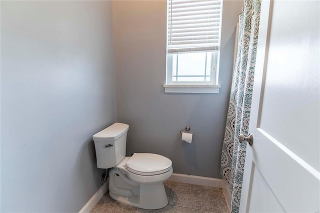 bathroom featuring tile patterned flooring and toilet