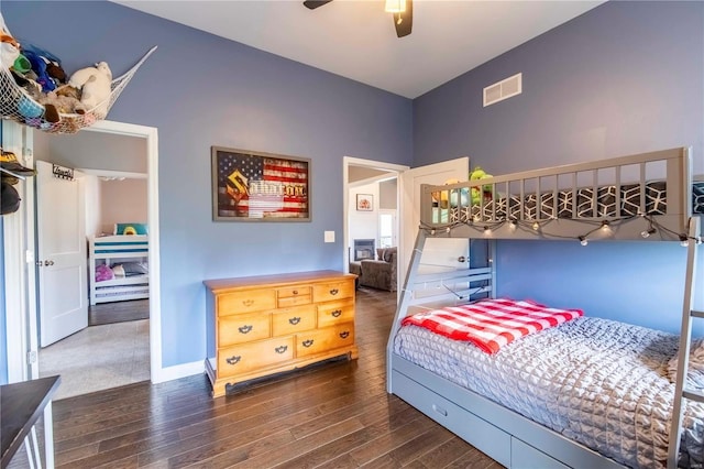 bedroom with dark wood-type flooring and ceiling fan