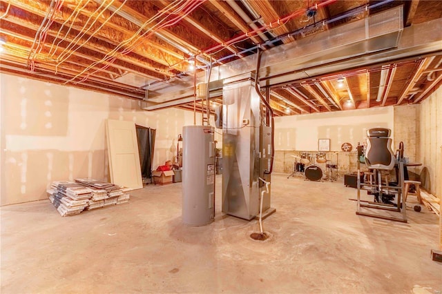 basement featuring heating unit and water heater