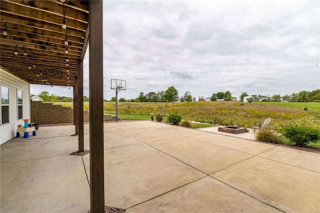 view of patio / terrace featuring a fire pit