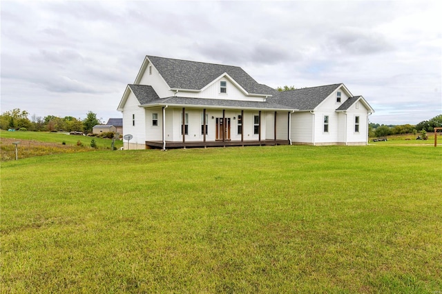 view of front of home featuring a front yard and covered porch