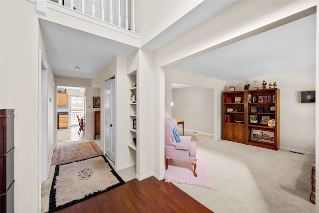 hallway with light hardwood / wood-style flooring