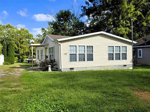 view of property exterior featuring a lawn