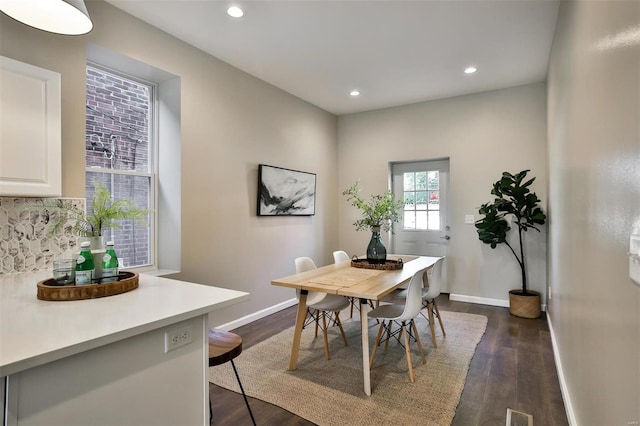 dining room featuring dark hardwood / wood-style flooring