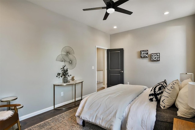 bedroom with ceiling fan and dark hardwood / wood-style floors