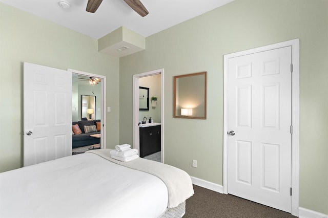 carpeted bedroom with ceiling fan and connected bathroom