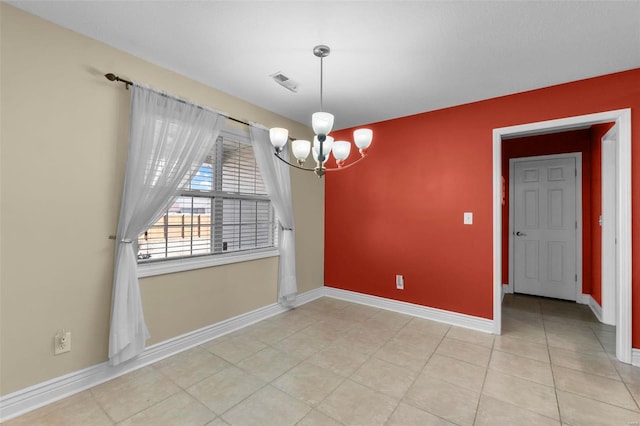 unfurnished dining area with light tile patterned floors and a chandelier