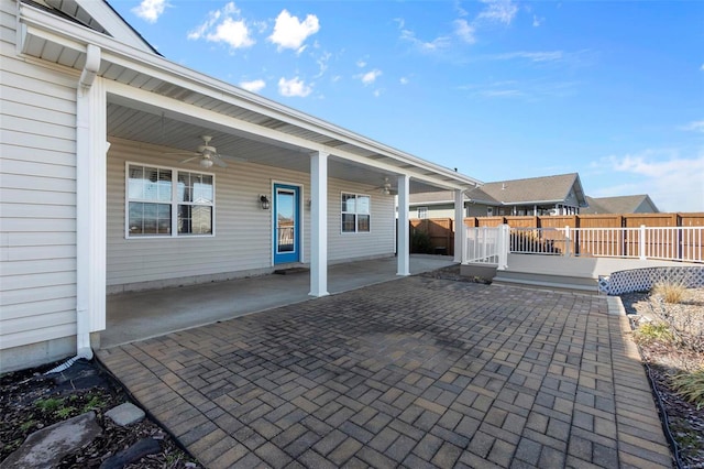 view of patio / terrace with a wooden deck and ceiling fan