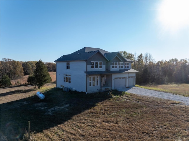 view of front of home featuring a garage and a front yard