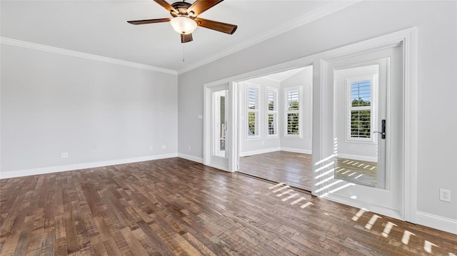 unfurnished room featuring ceiling fan, dark hardwood / wood-style flooring, and crown molding