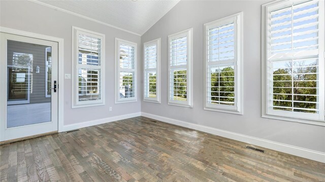 unfurnished sunroom featuring vaulted ceiling