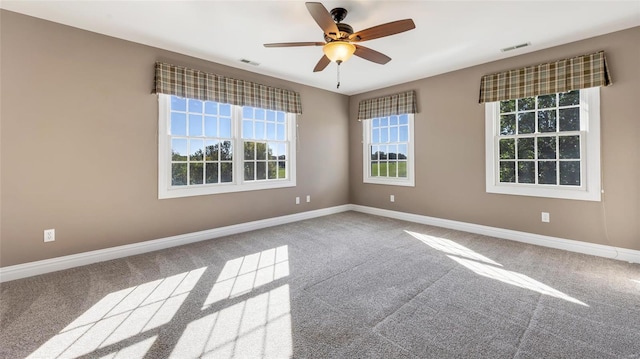 empty room featuring carpet and ceiling fan