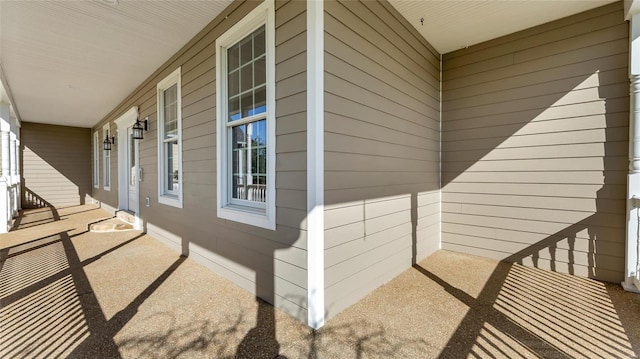 view of property exterior with a porch