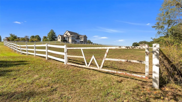 view of yard with a rural view