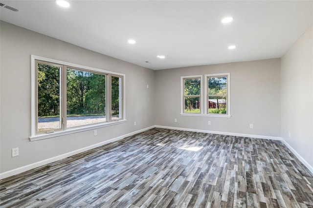 unfurnished room with hardwood / wood-style flooring