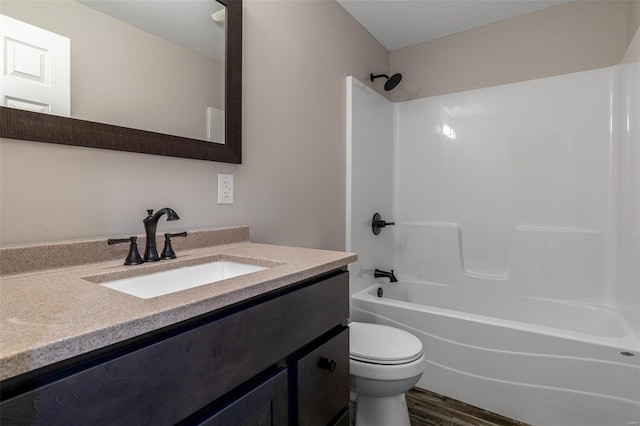 full bathroom with vanity, wood-type flooring, toilet, and shower / bathtub combination