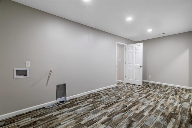 washroom featuring washer hookup and dark hardwood / wood-style flooring