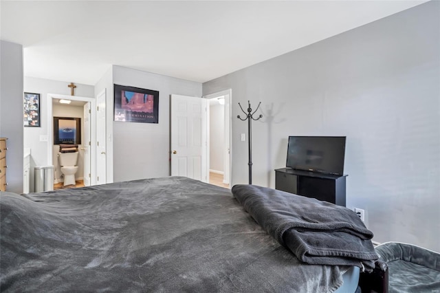 bedroom featuring connected bathroom