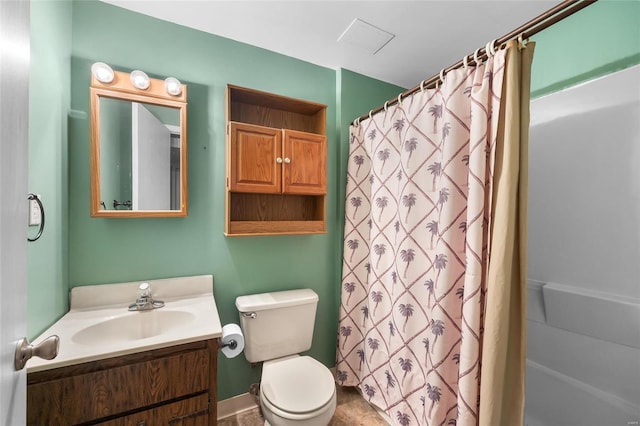 bathroom featuring vanity, toilet, and walk in shower