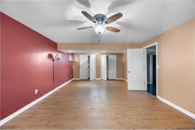 unfurnished room featuring light hardwood / wood-style floors and ceiling fan