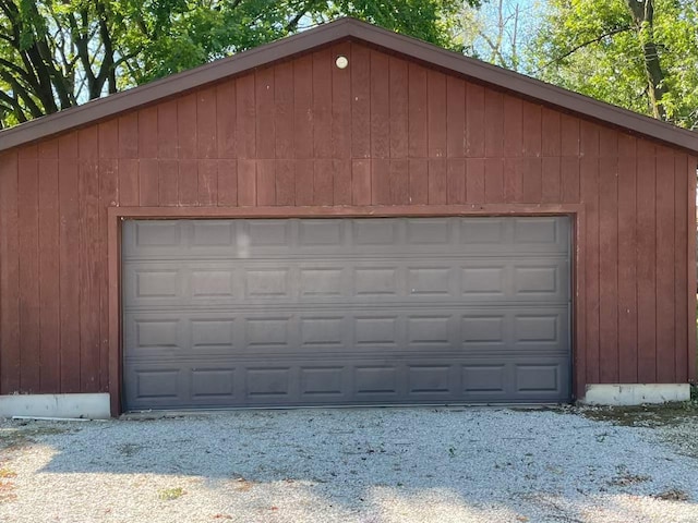 garage featuring wood walls