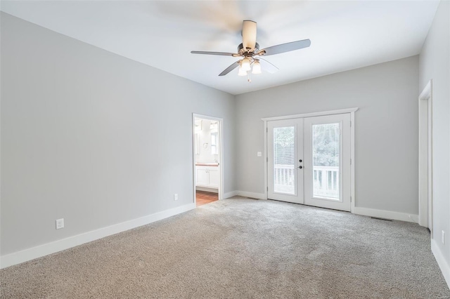 spare room with visible vents, baseboards, french doors, a ceiling fan, and carpet