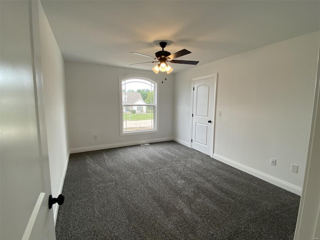 carpeted empty room with ceiling fan