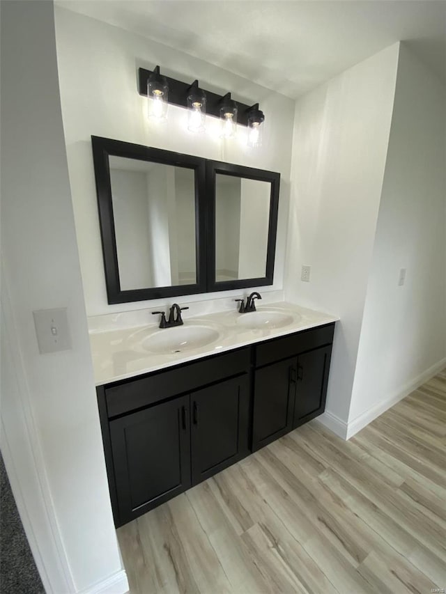 bathroom featuring wood-type flooring and vanity