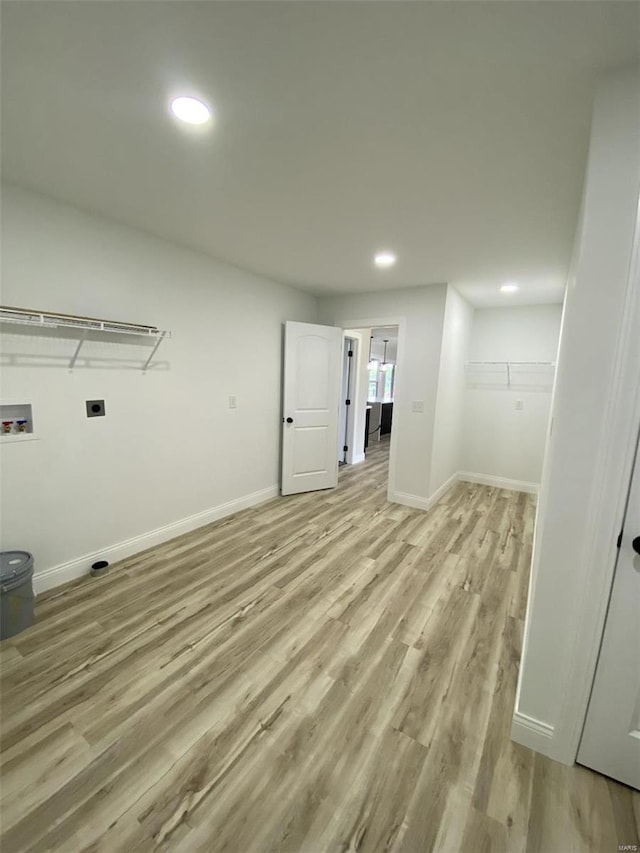 laundry room featuring light hardwood / wood-style floors and washer hookup