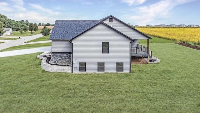 view of side of home featuring a lawn